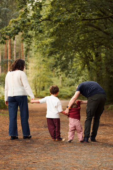 A family in a woodland setting enjoying a walk