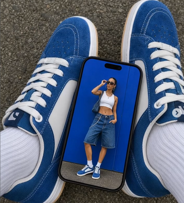 Barebarics Trainers from above including a phone with image of person in jorts and white top wearing sunglasses and Barebarics blue barefoot trainers