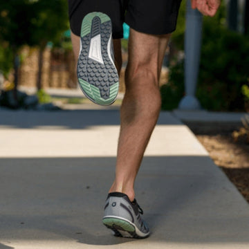 Man running in Xero trainers.