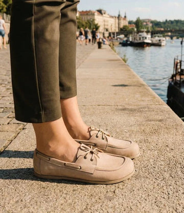 Person wearing barefoot moccasins.