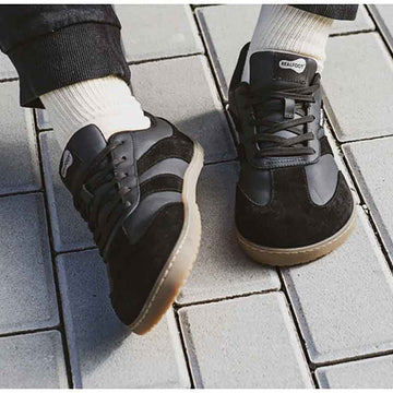 Adult wearing RealFoot trainers.