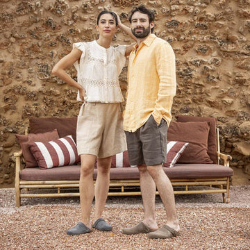 Man and woman wearing barefoot clogs.