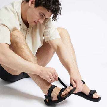 Man wearing vegan sandals.
