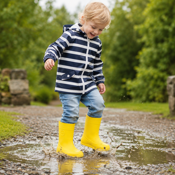 Child wearing Rayve Kids Wellingtons Monsoon - Yellow.