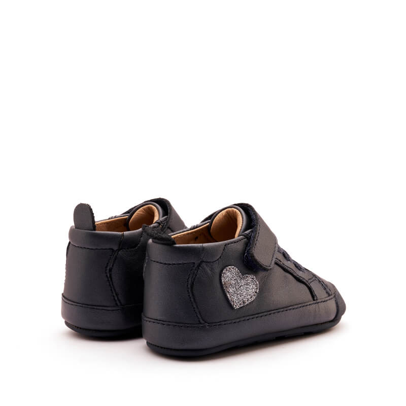 Pair of Old Soles Heartie Boots - Navy, angled view showing the outer side and rear.