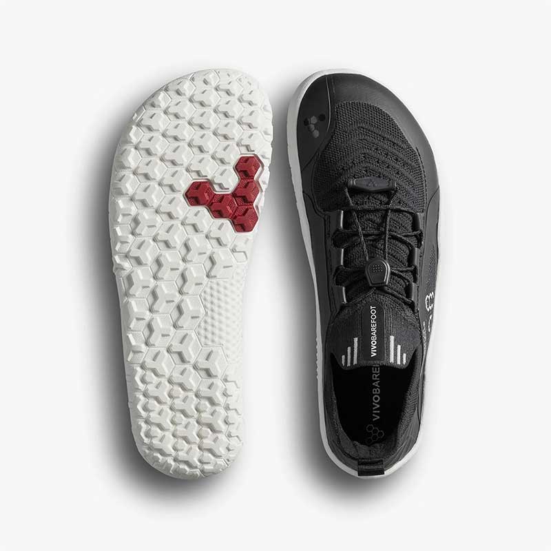 Pair of Vivobarefoot Kids Trainers Primus Trail Knit - Eclipse, one showing the sole view and the other showing the top view.
