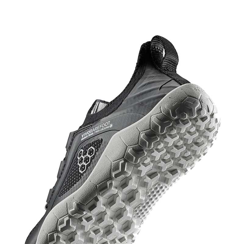 Vivobarefoot Kids Trainer Primus Trail Knit - Eclipse, angled view showing the sole.