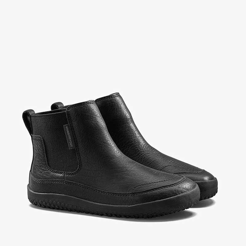 Pair of Vivobarefoot Kids Chelsea Boots Gobi - Obsidian, angled view showing outer side and front.