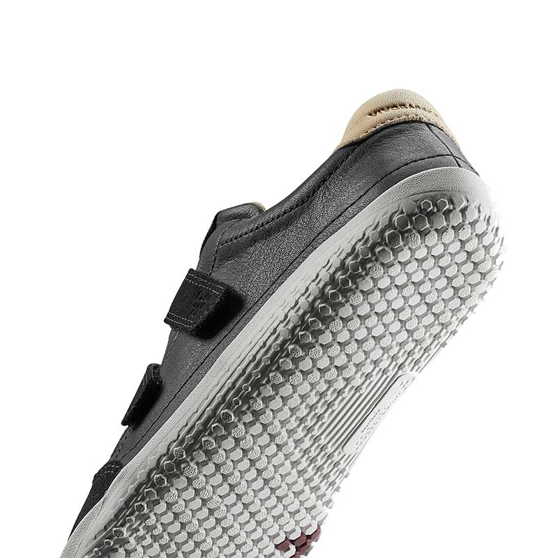 Vivobarefoot Kids Trainer Gobi - Obsidian, angled view showing the sole.