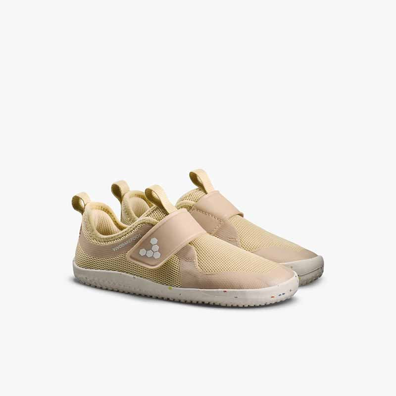 Pair of Vivobarefoot Kids Trainers Primus Sport IV - Stone, angled view showing outer side and front.