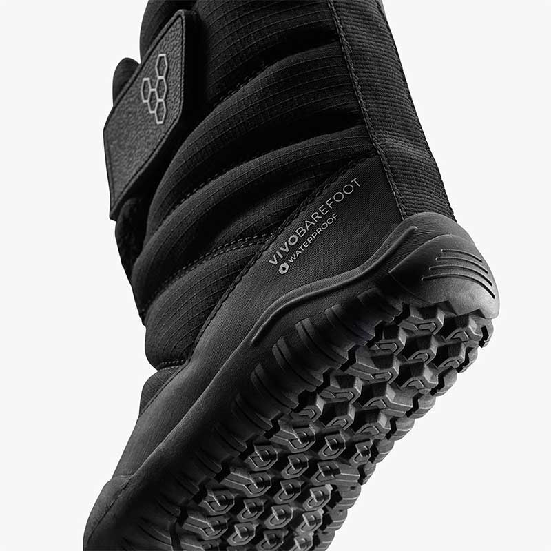 Vivobarefoot Toddler Boot Tracker AT - Obsidian, angled view showing the sole.