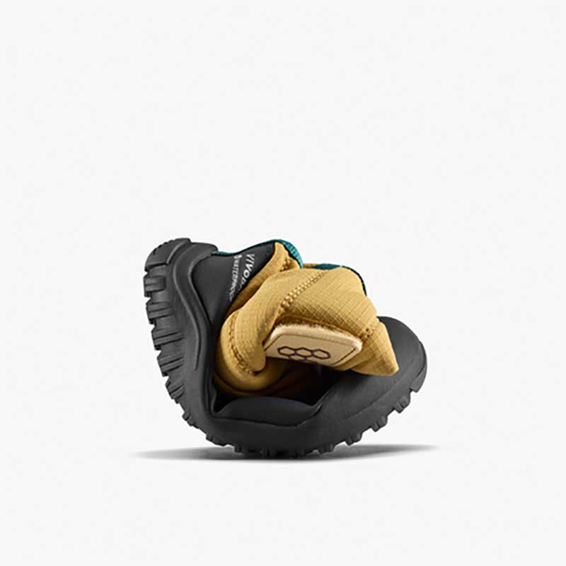 Vivobarefoot Toddler Boot Tracker AT - Wood, curled up.