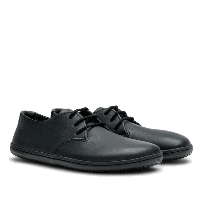 Pair of Vivobarefoot Women's Dress Shoes Ra - Obsidian, angled view showing the outer side and front.