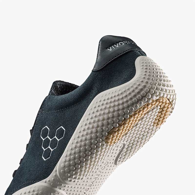 Vivobarefoot Women's Motus Studio Trainer - Obsidian and White, angled view showing the sole and heel.