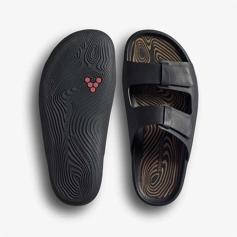 Pair of Vivobarefoot Women's Sandals Sensus Yin Slide - Obsidian, one showing the sole view and the other showing the top view.