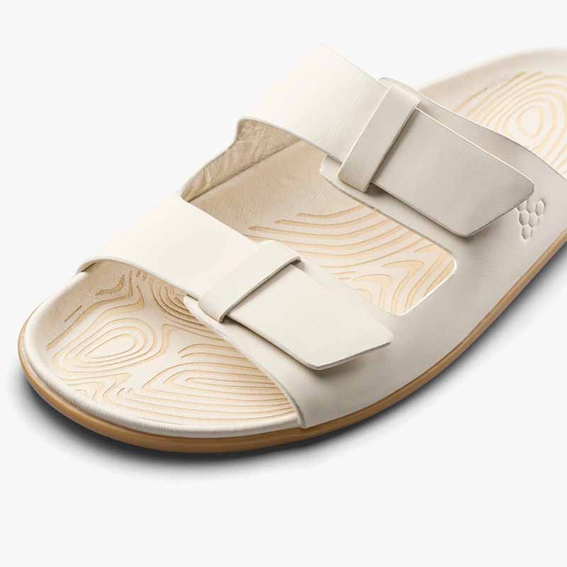 Vivobarefoot Women's Sandal Sensus Yin Slide - Sand, angled view showing the straps.