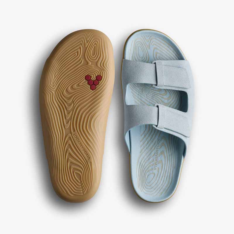 Pair of Vivobarefoot Women's Sandals Sensus Yin Slide - Skyway, one showing the sole view and the other showing the top view.