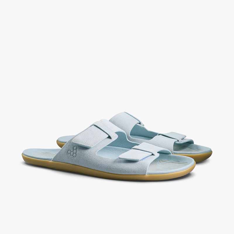 Pair of Vivobarefoot Women's Sandals Sensus Yin Slide - Skyway, angled view showing the outer side and the front.