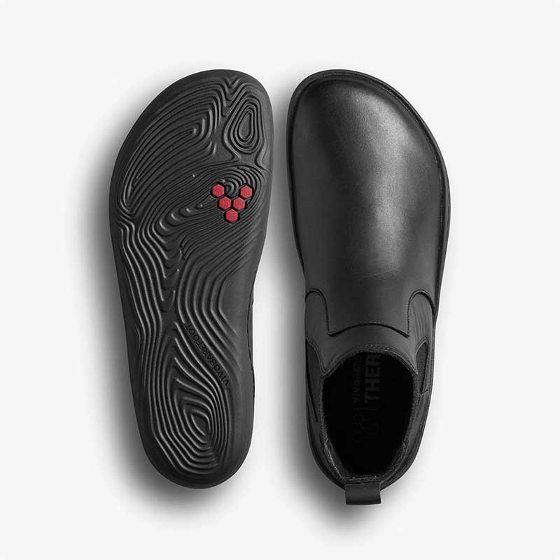 Pair of Vivobarefoot Women's Chelsea Boots Sensus - Obsidian, one showing the sole view and the other showing the top view.