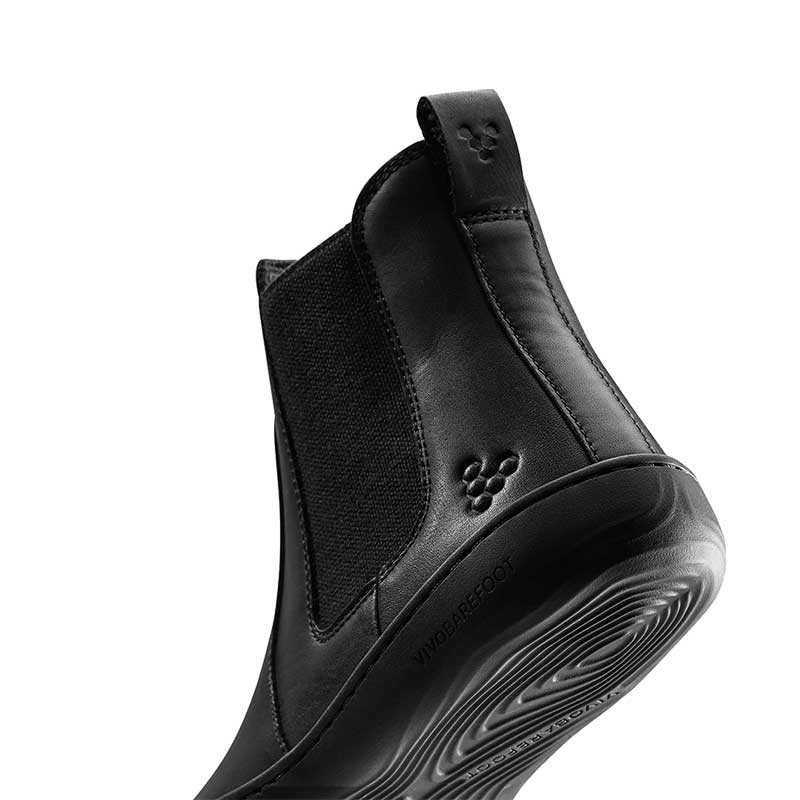 Vivobarefoot Women's Chelsea Boot Sensus - Obsidian, angled view showing the sole and heel.