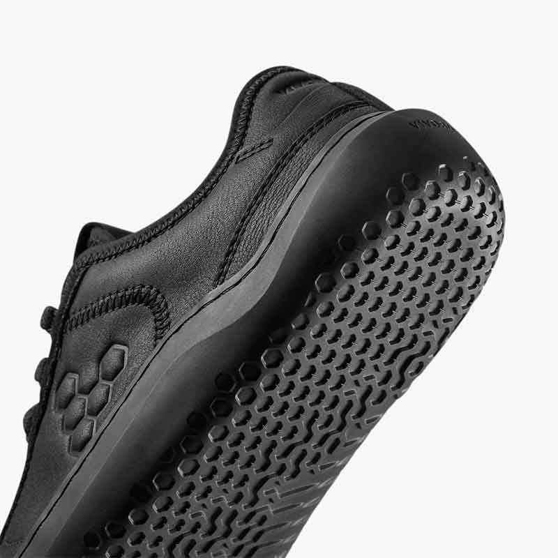 Vivobarefoot Women's Leather Trainer Gobi - Obsidian, angled view showing the sole.
