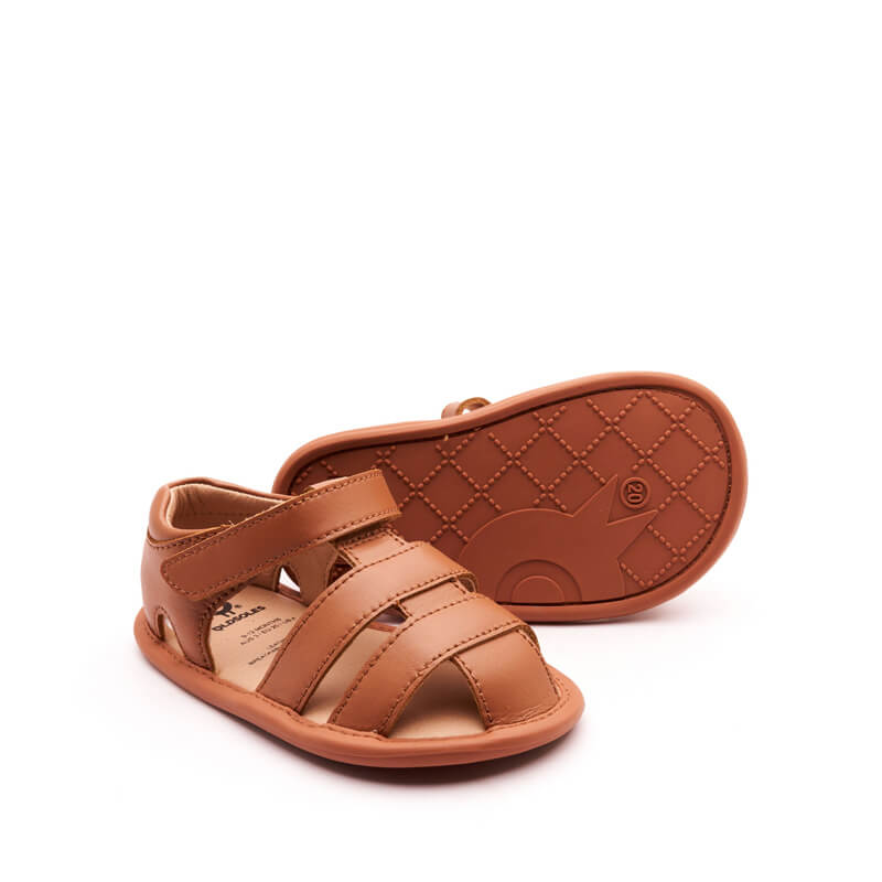 Pair of Old Soles Waves Sandals - Tan, one angled showing outer side and front, the other on it's side showing the sole.