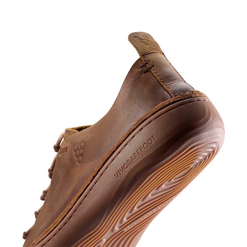 Vivobarefoot Men's Sensus Moc Lace Up Shoe Dark Tan, angled view showing the sole.
