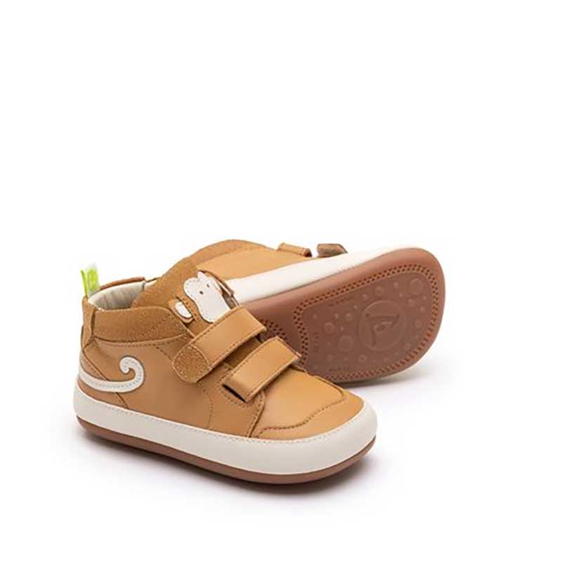 Pair of Tip Toey Joey Toddler Boots Monkey Hug - Hay, one on it side showing the sole view and the other angled, showing outer side and front view.