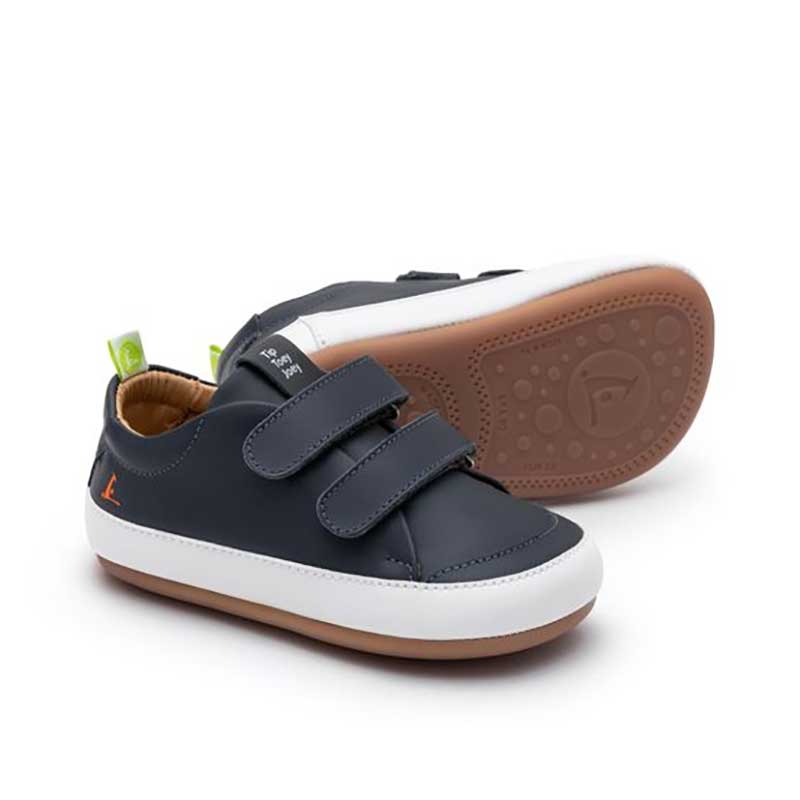 Pair of Tip Toey Joey Kids Trainers Bossy - Navy and White, one on its side showing the sole view and the other, angled showing the outer side and front.