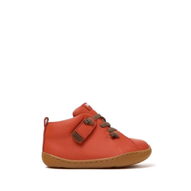 Camper Kids First Peu Boot in orange, outer side view.