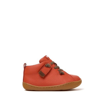 Camper Kids First Peu Boot in orange, outer side view.