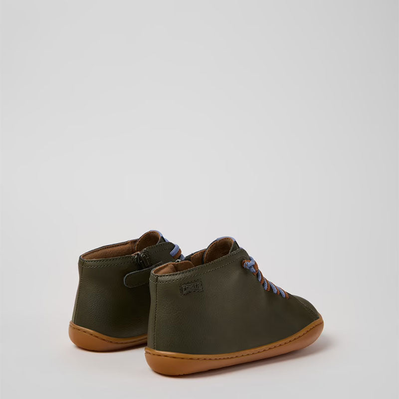 Pair of Camper Kids Peu Boots in green, angled view showing outer side and rear.