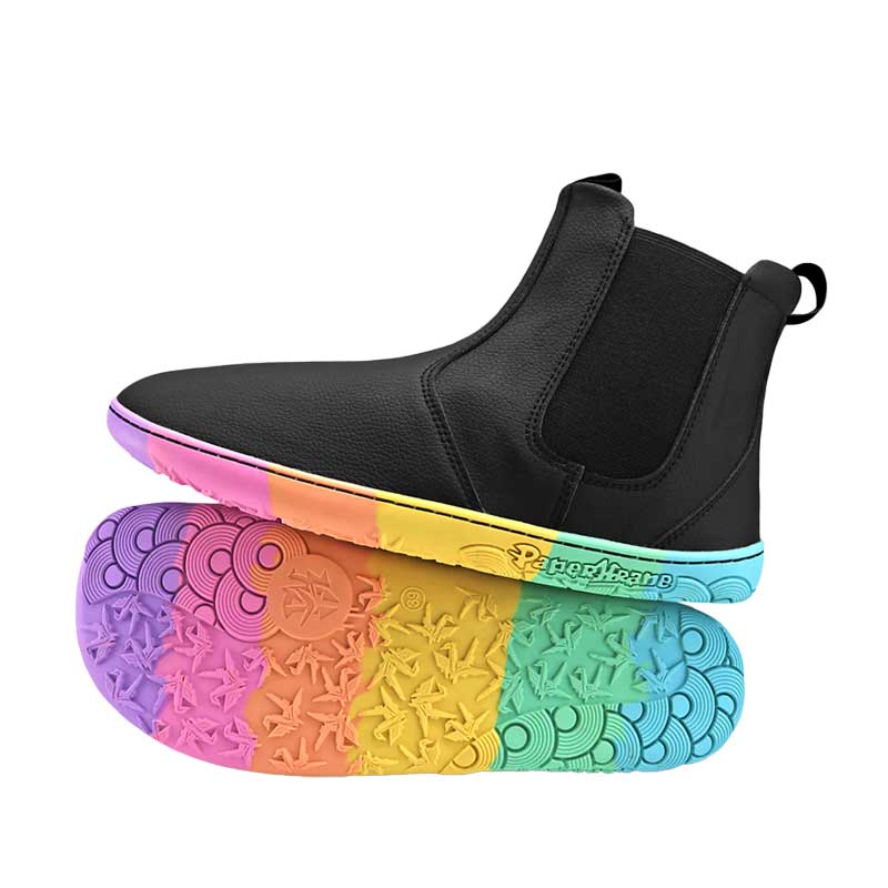 Pair of PaperKrane Adults Chelsea Boots - Kranebow, one balanced on top of the other. One showing the outer side view and the other showing the sole view.