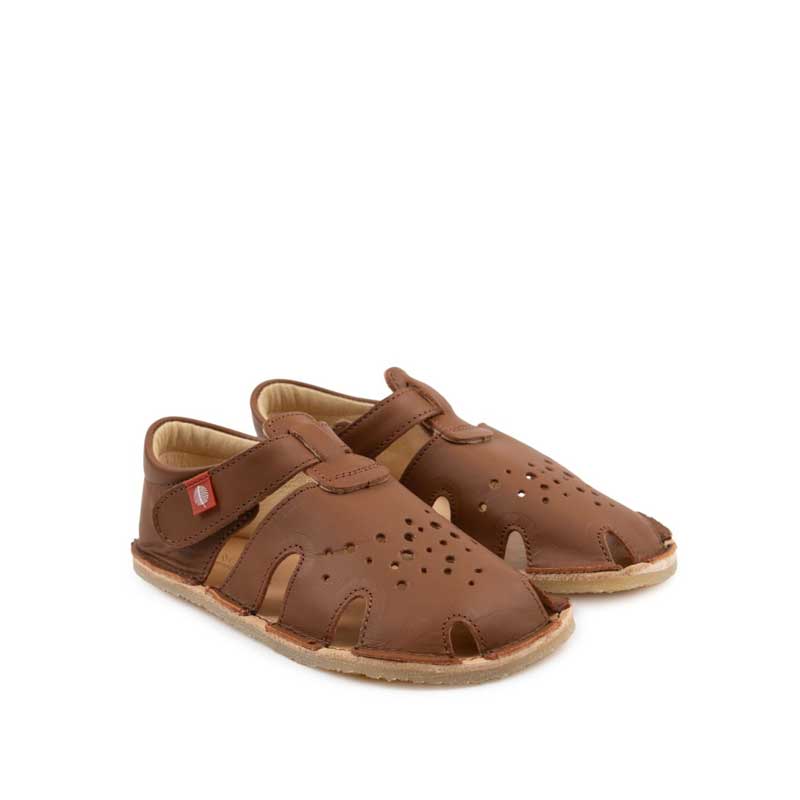 Pair of Tikki Kids Sandals Aranya - Caramel, angled view showing outer side and front view.