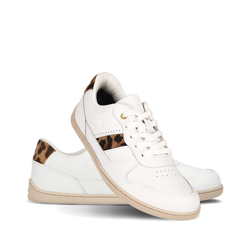 Pair of Be Lenka Adults Trainers Cellestia White and Leopard, one angled and leaning showing the outer side, the other partially showing the inner side