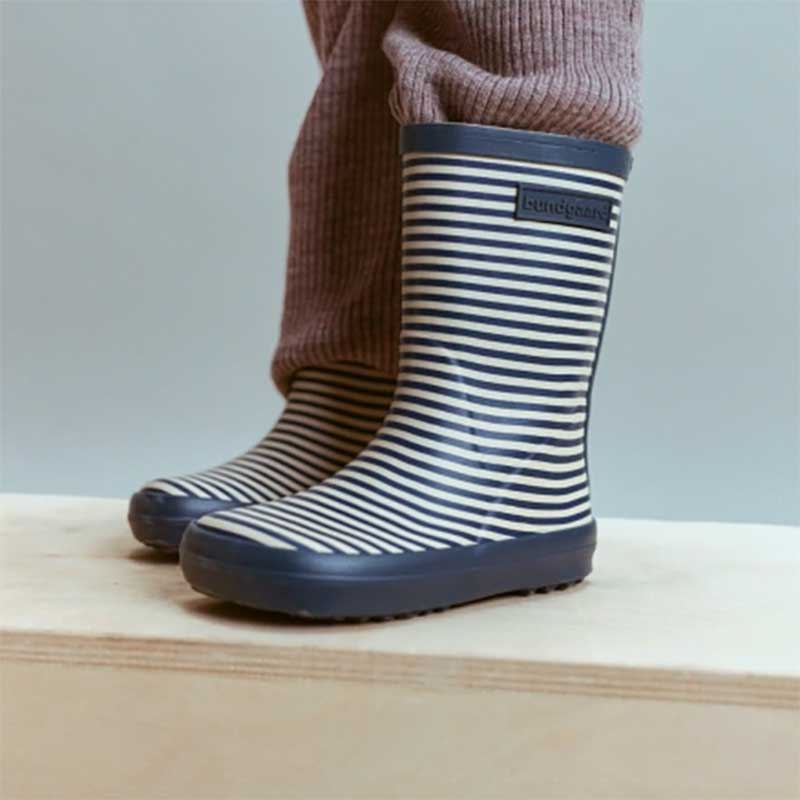 Child wearing Bundgaard Kids Wellies Classic Charly High 2 - Navy Stripe.