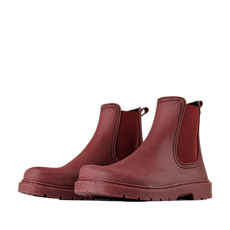 Pair of El Naturalista Barefoot Chuva Wellington Boots - Wine, angled view showing outer side and front.