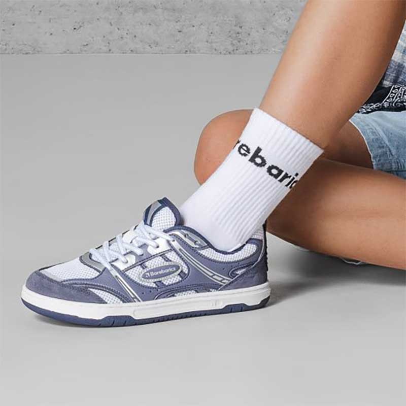 Person wearing Be Lenka Adults Barebarics Trainers Dropsta - Blue and Silver with white Barebarics socks.