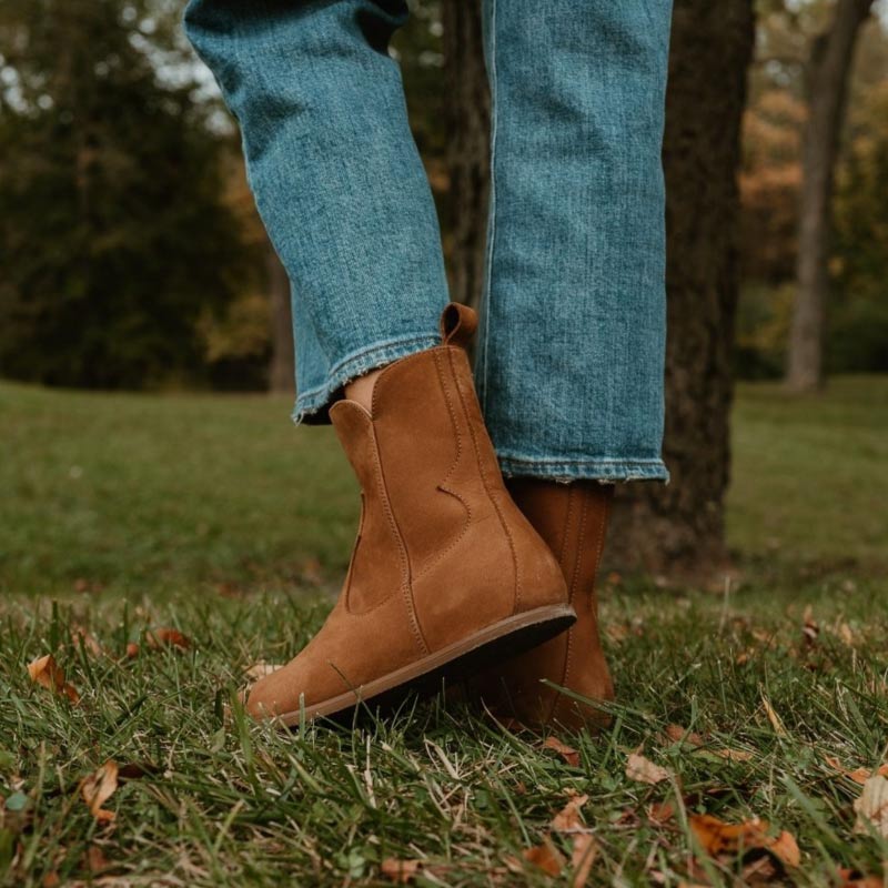 Person wearing Anya's Faye Boots - Cider, side and rear view.
