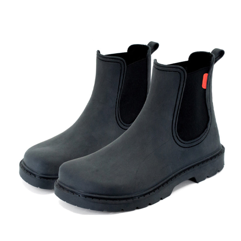 Pair of Mukishoes Galocha Wellington Boots - Black, angled view showing outer side and front.