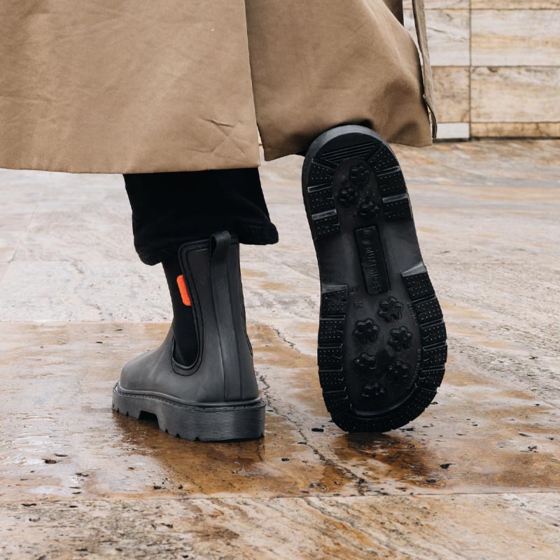 Person wearing Mukishoes Galocha Wellington Boots - Black.