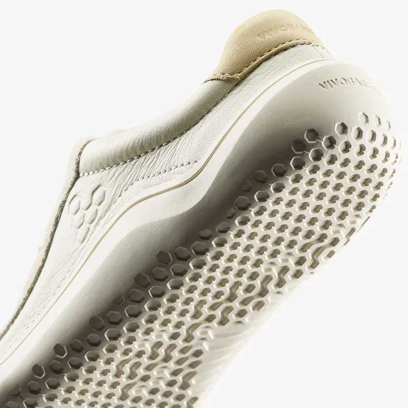 Vivobarefoot Junior Trainer Gobi - Limestone, angled view showing the sole.