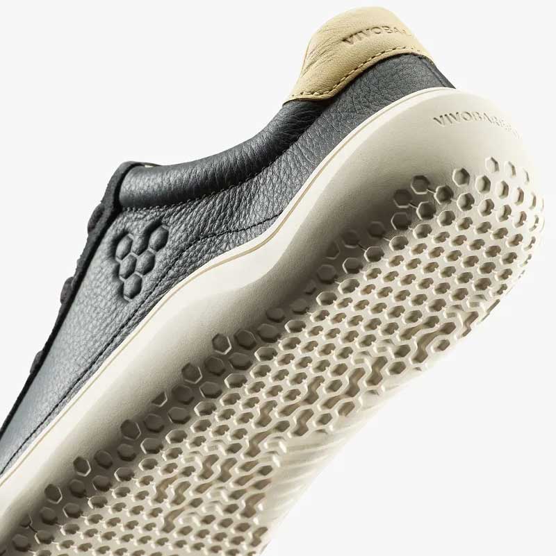 Vivobarefoot Junior Trainer Gobi - Obsidian, angled view showing the sole.