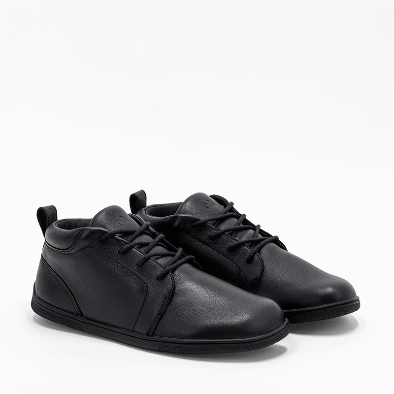 Pair of Be Lenka Adults Boots Icono - Black, angled view showing outer side and front.