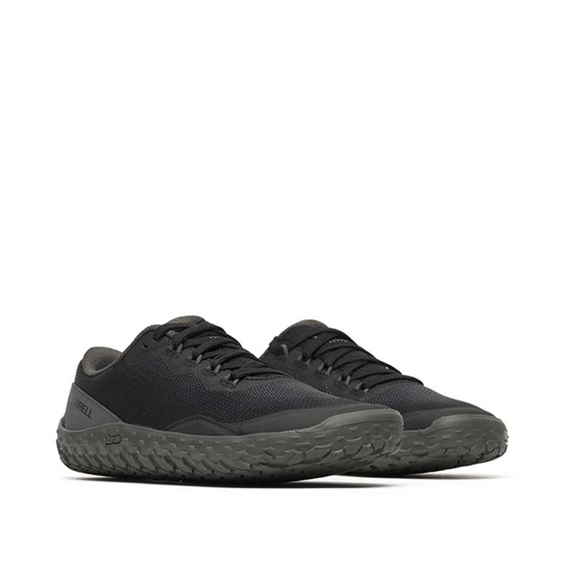 Pair of Merrell Women's Vapor Glove 7 Trainers - Black, angled view showing outer side and front.