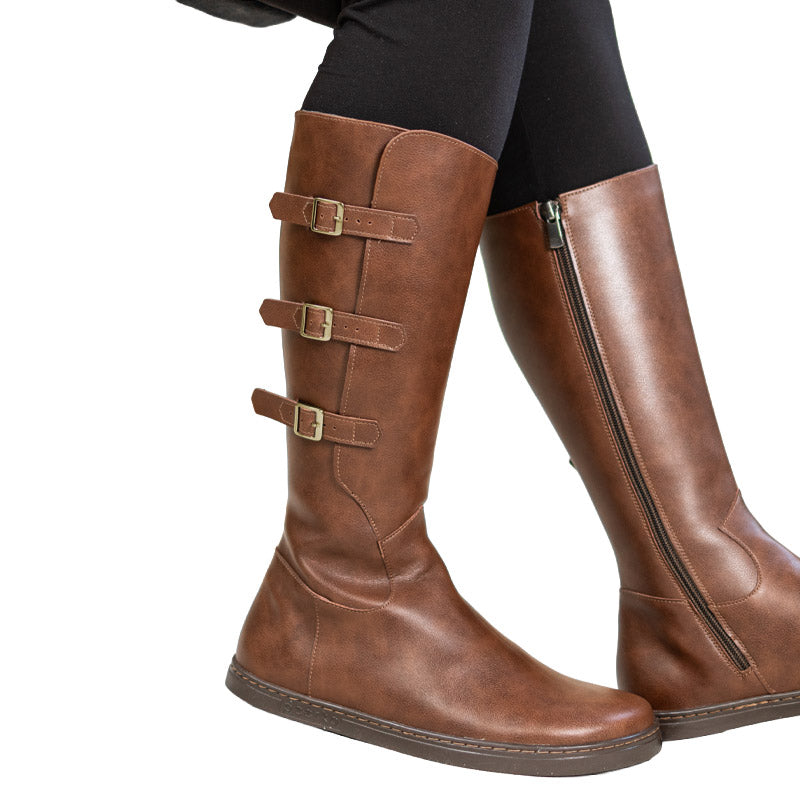 Person wearing Peerko Women's Boots Joana - Brown, side view.
