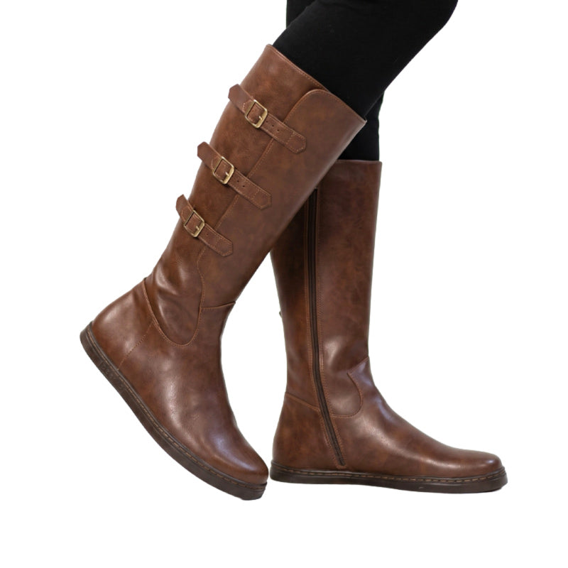 Person wearing Peerko Women's Boots Joana - Brown with black leggings.