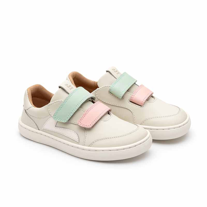 Pair of Tip Toey Joey Kids Trainers Landy - Mint and Pink, angled view showing outer side and front.