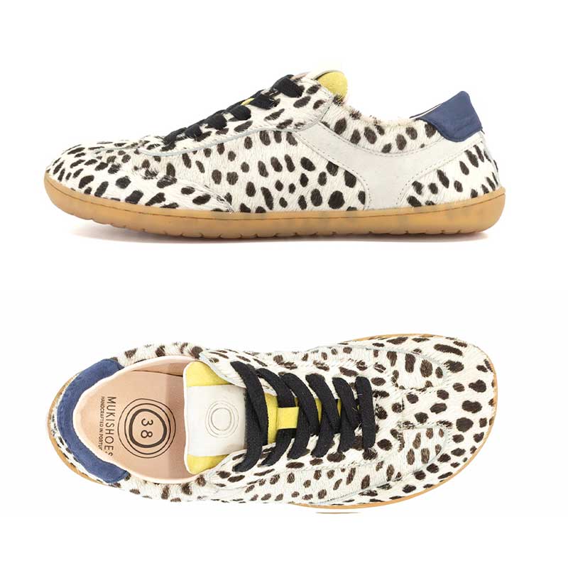 Pair of Mukishoes Trainers Lyra - Cruella, one showing the outer side view and the other showing the top view.