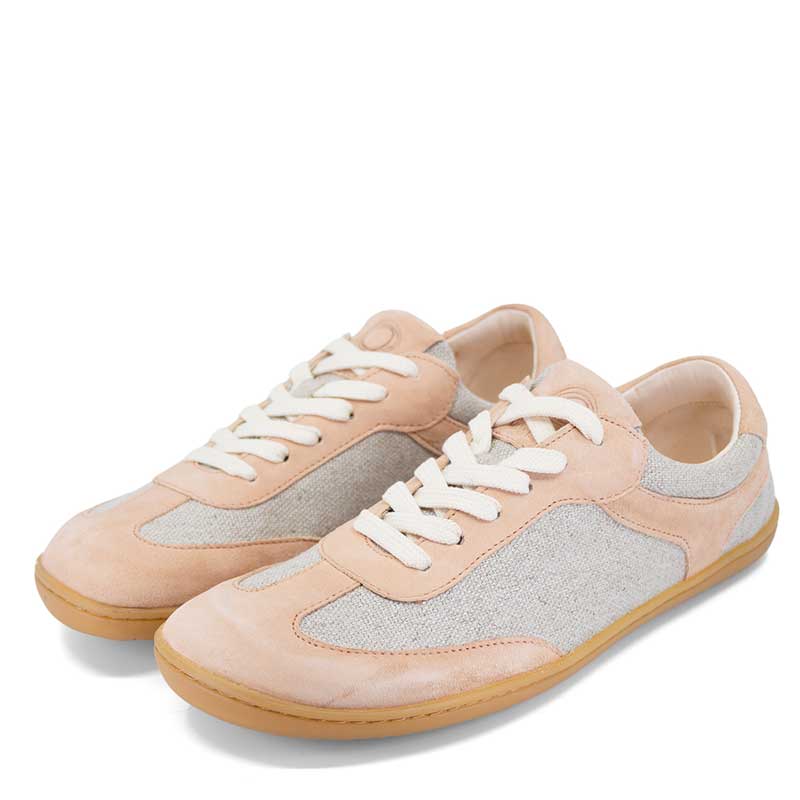 Pair of Mukishoes Trainers Lyra - Venus, angled view showing outer side and front.